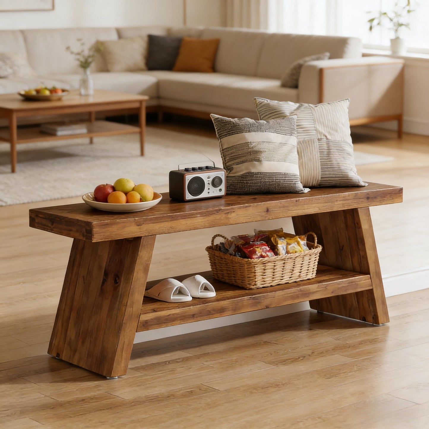 Wooden coffee table with fruit bowl, radio, and basket in a living room setting