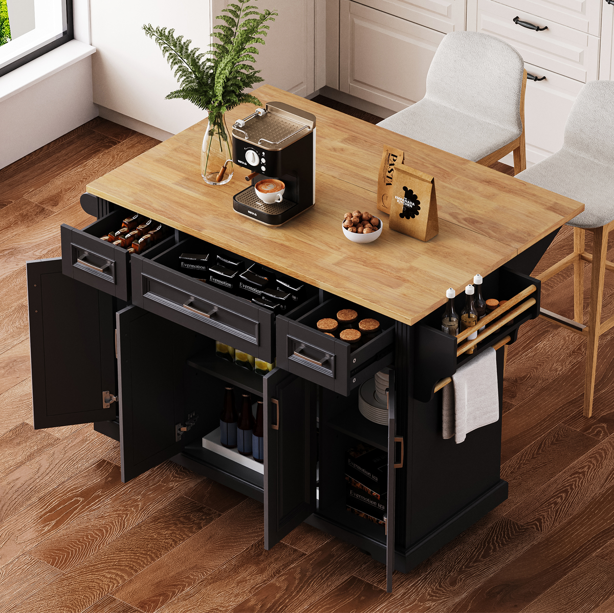 Angled view of a black kitchen island with a natural wood-look countertop, open storage drawers and cabinets, side spice rack, towel holder, and coffee machine.
