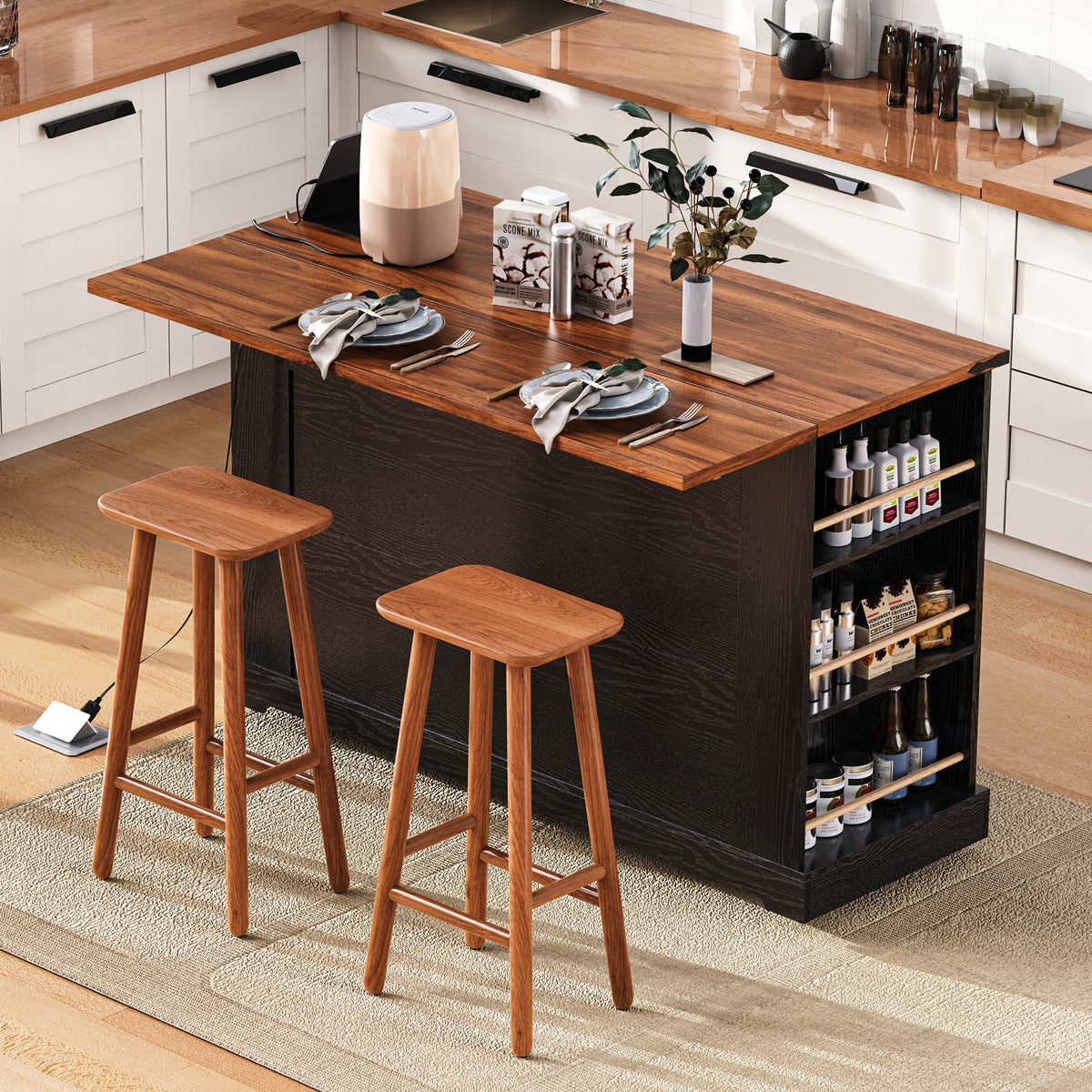 Rear view of a black kitchen island breakfast bar set for two, with wooden stools and side spice shelves.