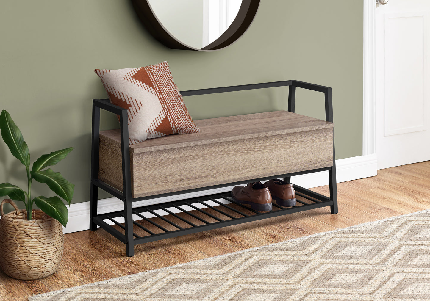 Wooden bench with shoe storage shelf against a green wall with a mirror.