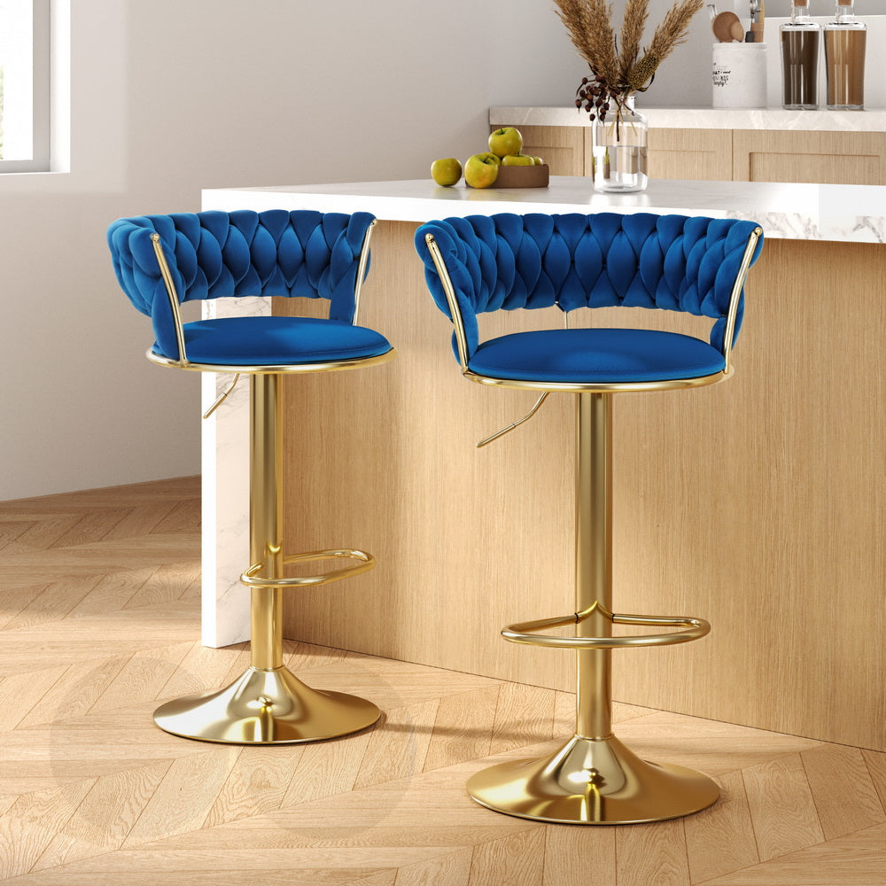 Elegant NORDIQE Vivien Bar Stools in navy velvet featuring a tufted backrest and a sleek gold base — perfect for modern spaces.