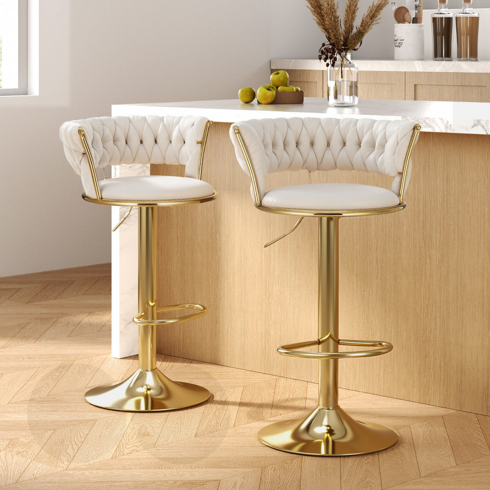 Elegant NORDIQE Vivien Bar Stools in ivory with tufted upholstery — featuring a sleek gold base and modern design.