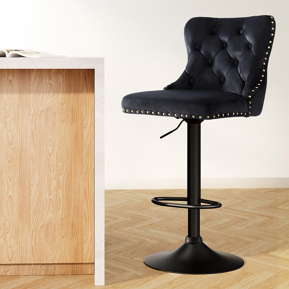 Chic Solozi Velvet Bar Stool by NORDIQE in black with elegant tufting and stylish studded detailing, perfect for modern interiors.