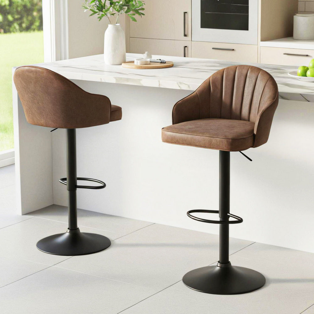 Sagana Bar Stools by NORDIQE in rich brown faux leather with a stylish ribbed design and sleek black metal base.