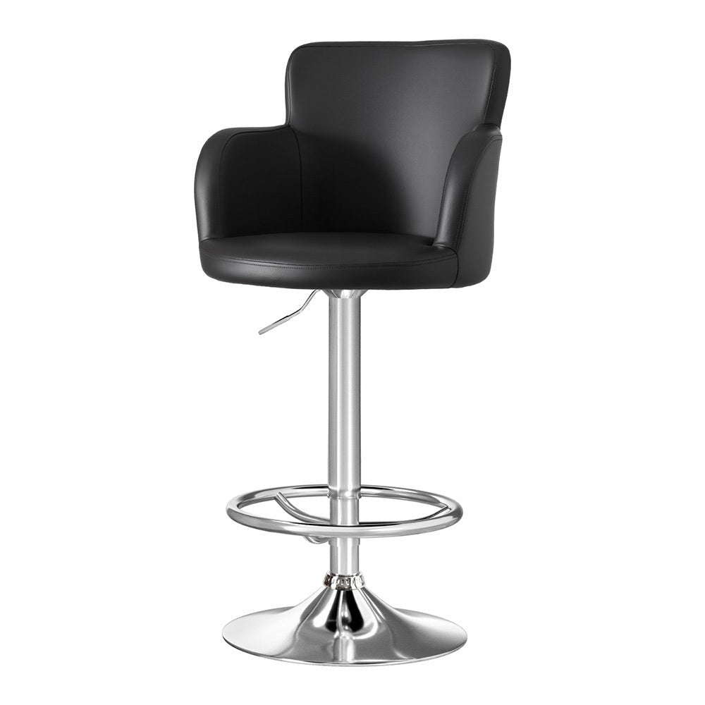 Modern NORDIQE Dramos swivel bar stool in sleek black faux leather with a polished chrome base and comfortable armrests