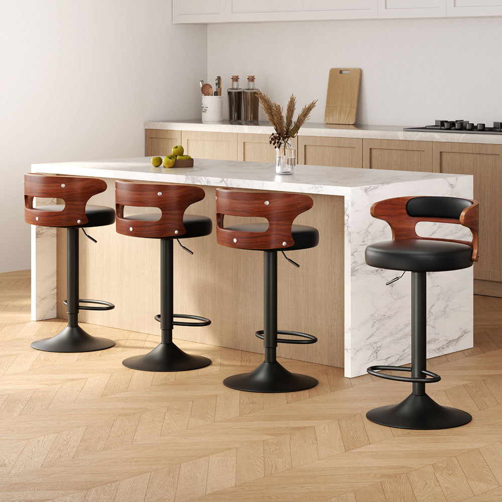 Sleek NORDIQE Grandeur Bar Stools in black and brown with curved wooden backs — modern design enhancing a contemporary kitchen setting.