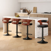 Sleek NORDIQE Grandeur Bar Stools in black and brown with curved wooden backs — modern design enhancing a contemporary kitchen setting.