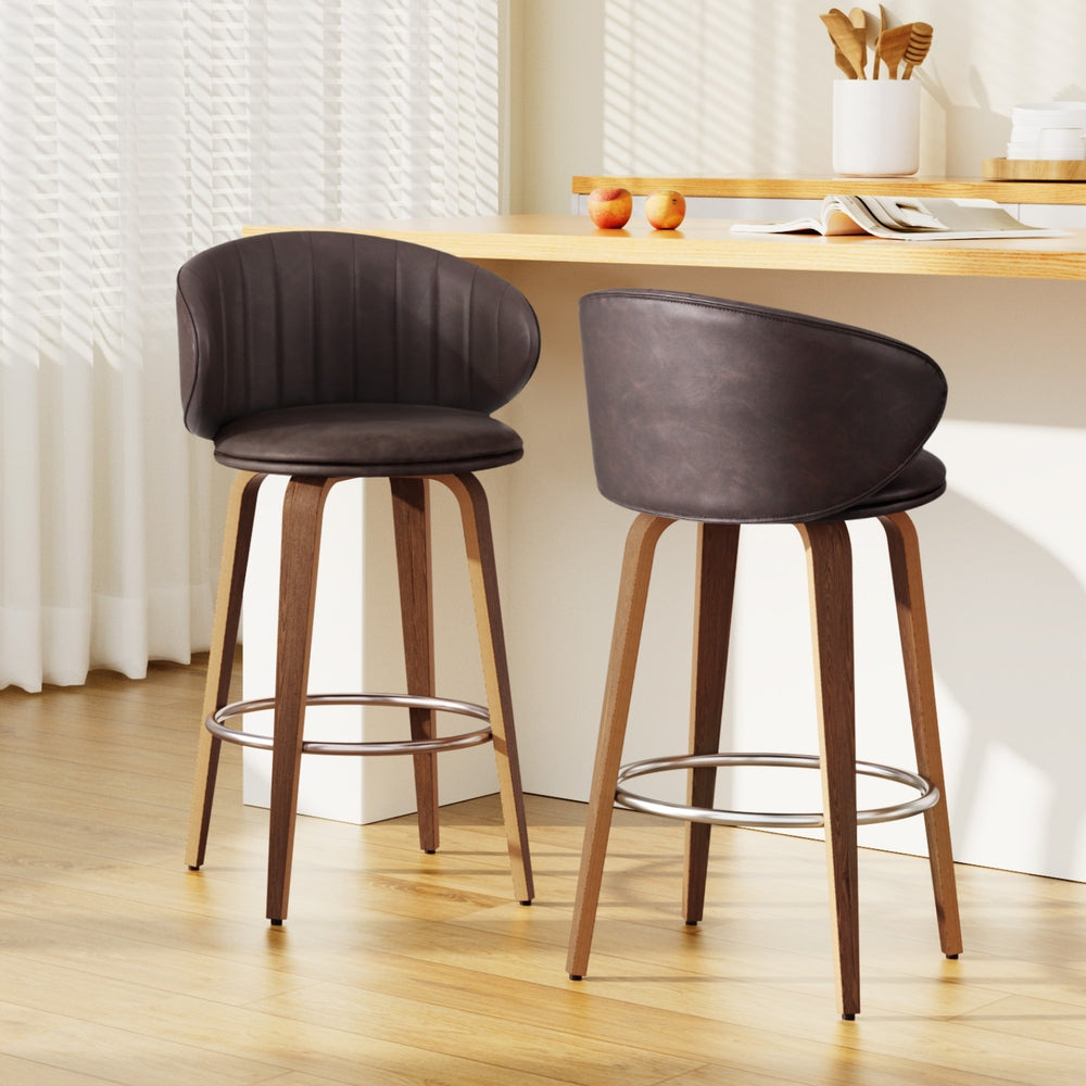 Stylish NORDIQE Flarion Bar Stools in brown leather with ribbed backrest — perfect for modern kitchen or bar settings