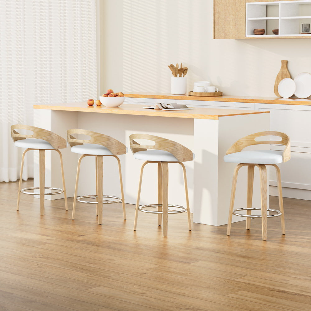Chic NORDIQE Ranadi bar stools in white and beige featuring a sleek wooden backrest — perfect for modern kitchen settings.