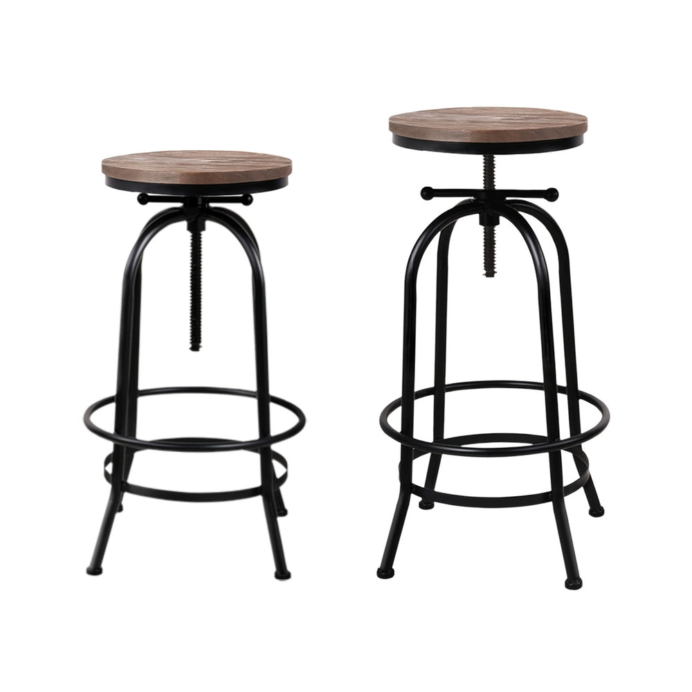 Adjustable NORDIQE Katona Industrial Bar Stool in black metal with a rustic brown wooden seat — perfect for modern interiors.