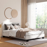 Modern bedroom with a bed, pillows, and a window with curtains.