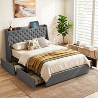 Gray upholstered bed with storage drawers in a bedroom setting.