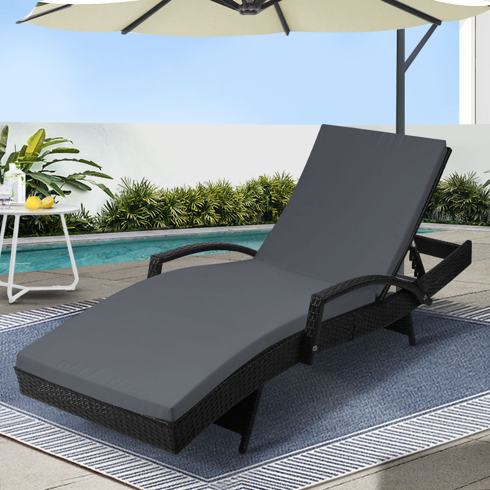 Black wicker outdoor sun lounge chair by NORDIQE with adjustable cushion for patio use