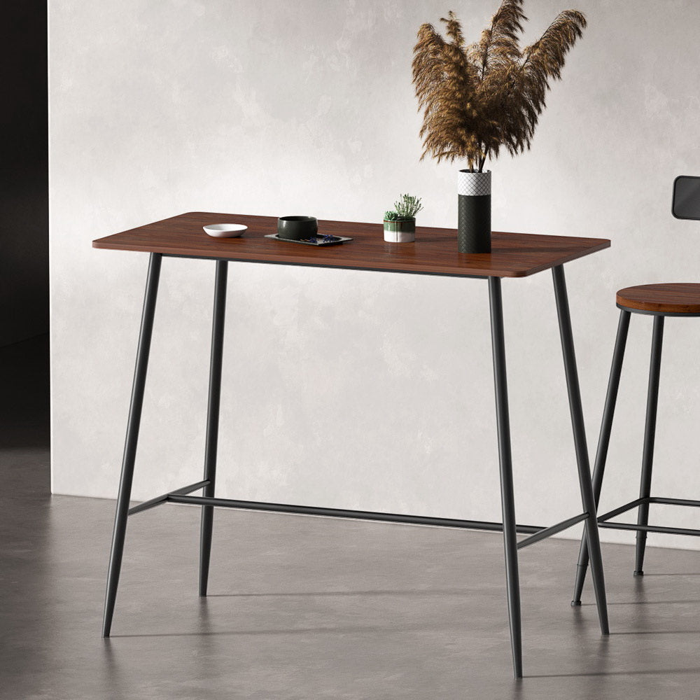 NORDIQE Halle Bar Table in brown with black metal legs, styled with a vase and small plant