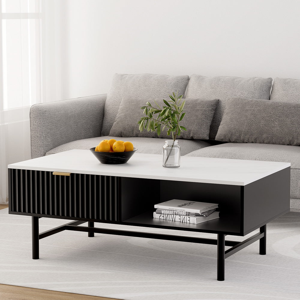 Modern living room with a gray sofa and a white coffee table.