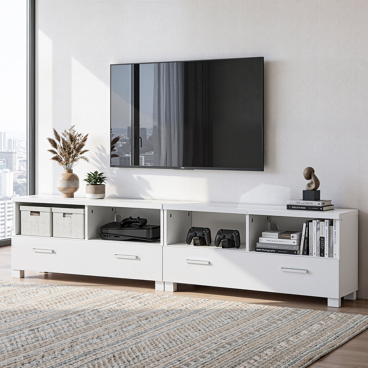 White entertainment console with TV and decorative items in a modern living room.