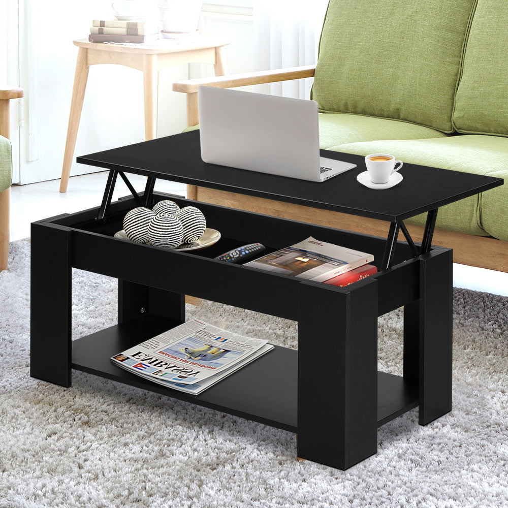 Black coffee table with lift-top design in a living room setting.