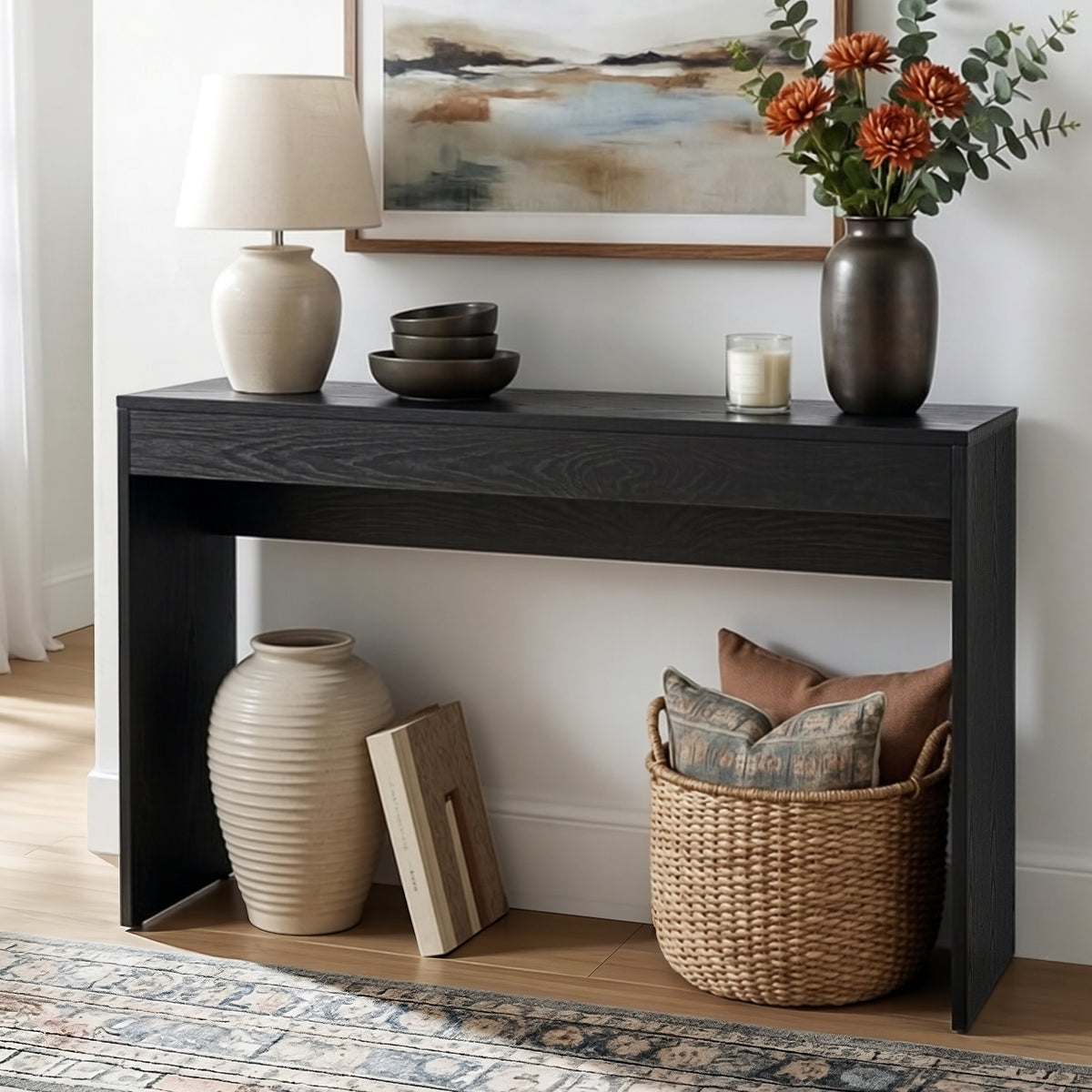Black console table by NORDIQE, 120cm long, suitable for hallway or entryway use.