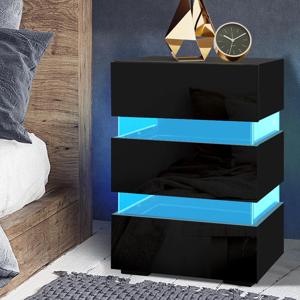 Black and blue nightstand with decorative items in a bedroom setting