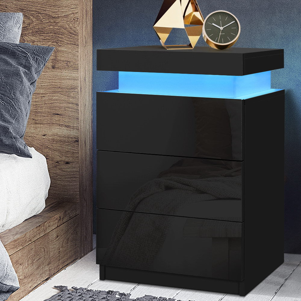 Black dresser with blue LED lighting in a bedroom setting