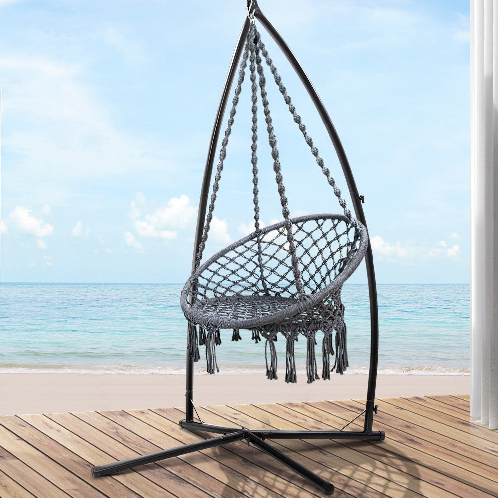 Blefnor Hammock Chair | Grey hanging on a stylish stand by the beach, perfect for relaxation and unwinding.