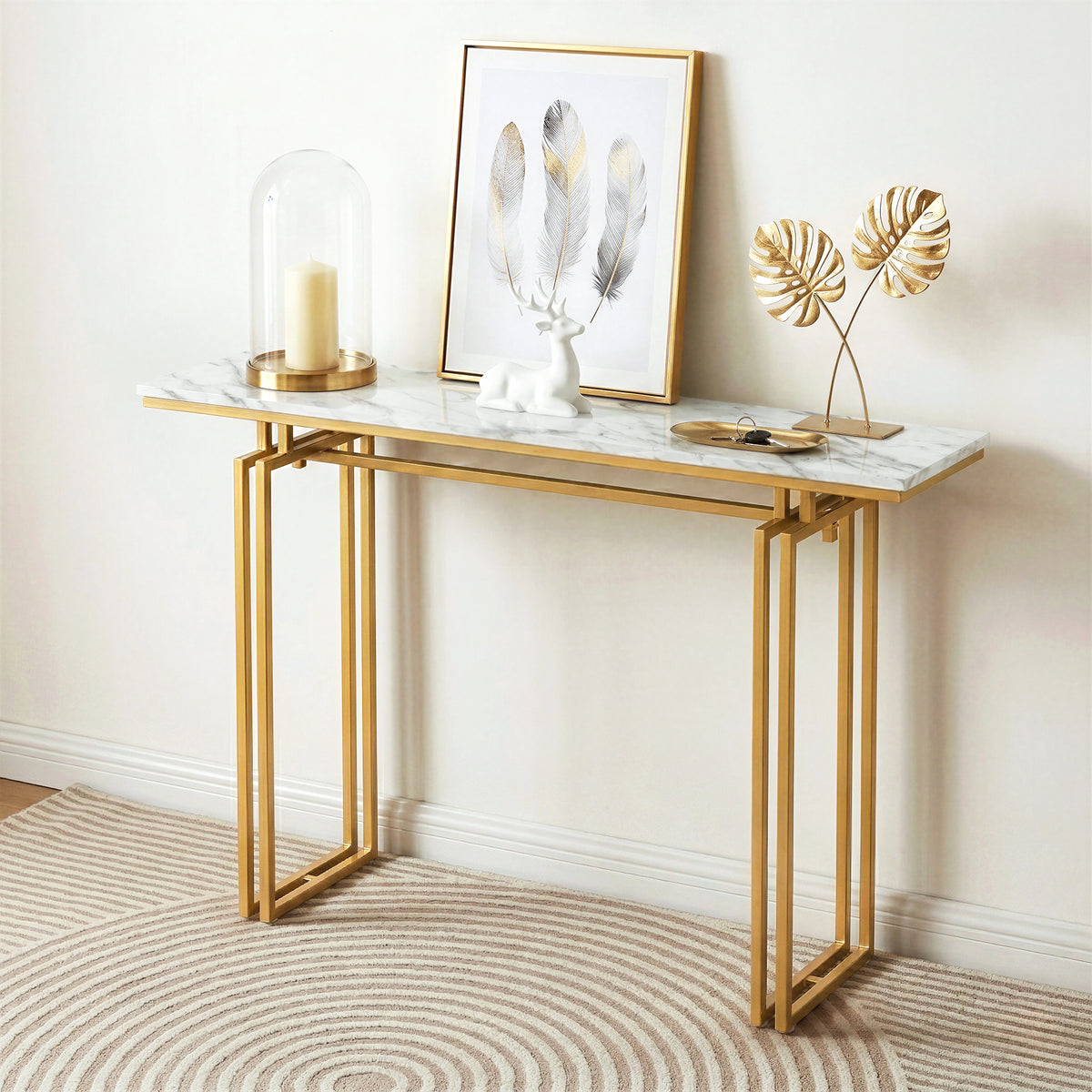 Gold console table with marble top in a room setting
