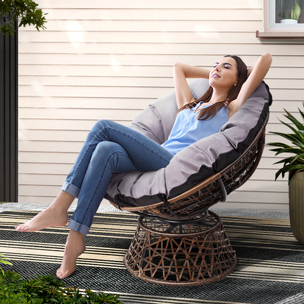 Wicker Papasan chair in brown with gray cushion by NORDIQE for outdoor use