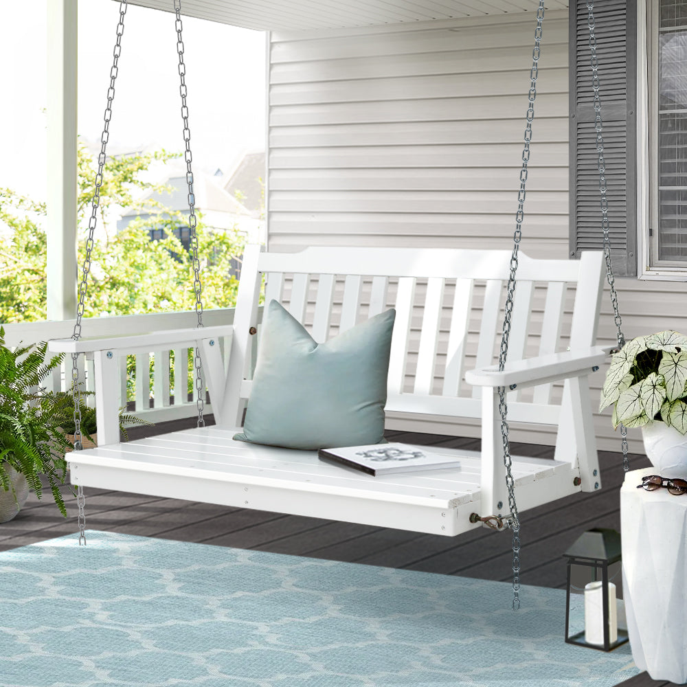 White wooden porch swing chair by NORDIQE with hanging chain for outdoor use
