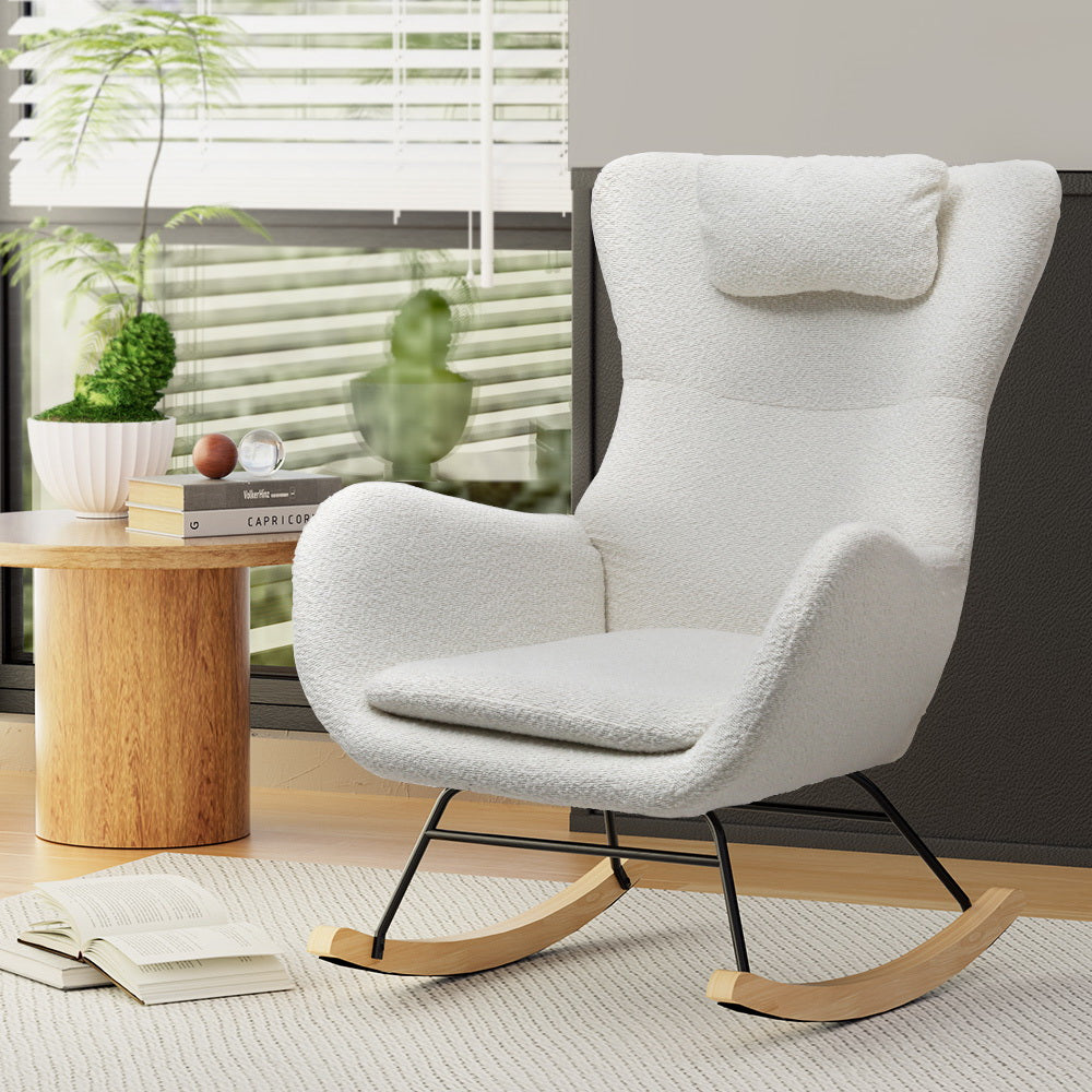 Cozy NORDIQE Ada Rocking Chair in boucle white with a plush texture, perfect for relaxing in a sunlit room.