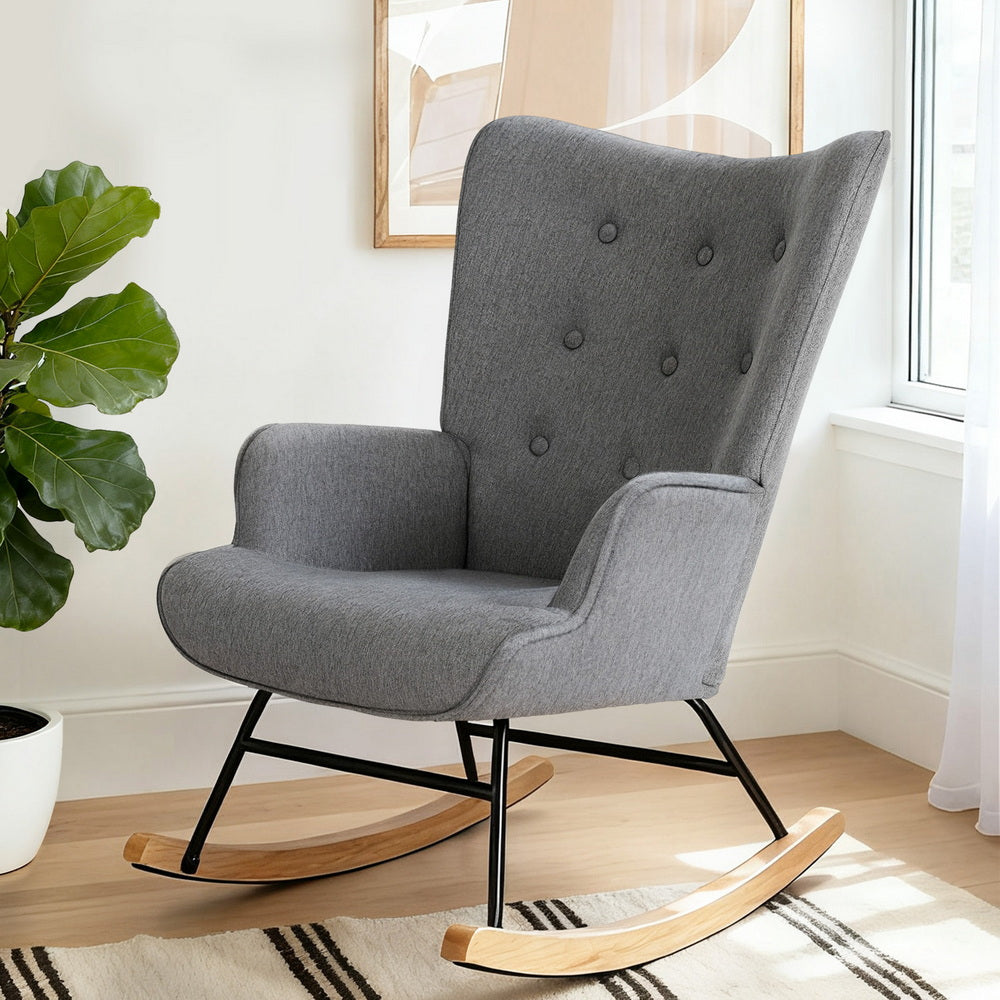 The Vitalys Rocking Armchair by NORDIQE features a grey fabric upholstery with a modern design—perfect for cozy living spaces.