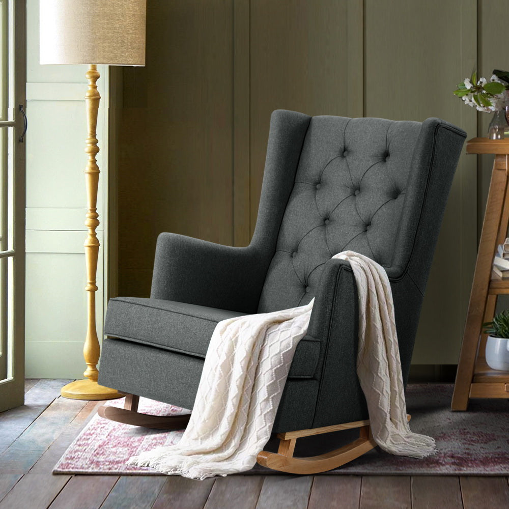 Rocking chair in charcoal linen fabric by NORDIQE with tufted back and wooden base