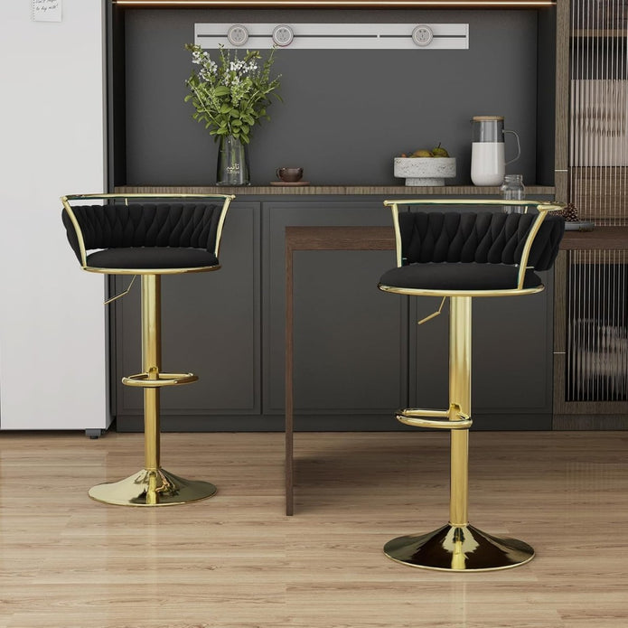 Stylish NORDIQE Mythoria golden counter stools in black with a quilted design — perfect for modern kitchen spaces.