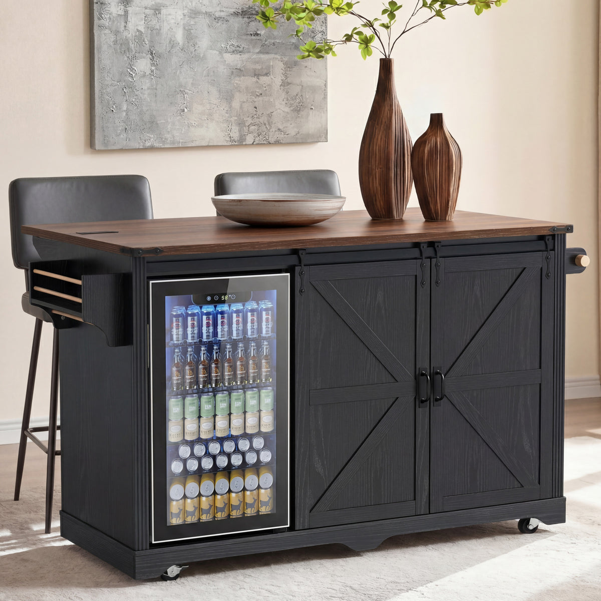 Black kitchen island with a left-side beverage cooler and sliding barn-style doors, topped with sculptural vases.